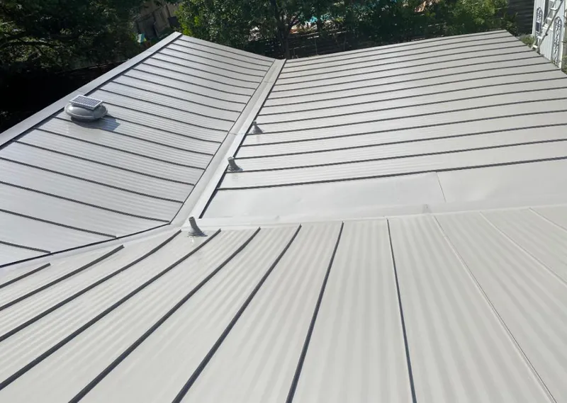 Solar attic fan installed on a metal roof for Roof Ventilation in Greece